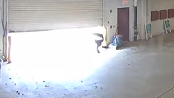 Video shows inmate escape jail by diving under closing garage door