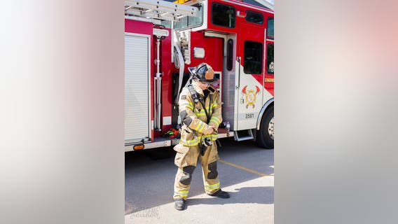 Firefighter stands for 1 minute for every firefighter who died on 9/11