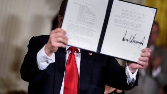 Trump signs directive to clean up space junk; asks Pentagon to create 'Space Force'