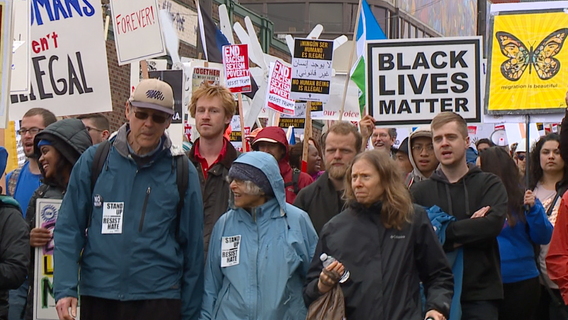 Hundreds march peacefully on May Day for workers and immigrants rights