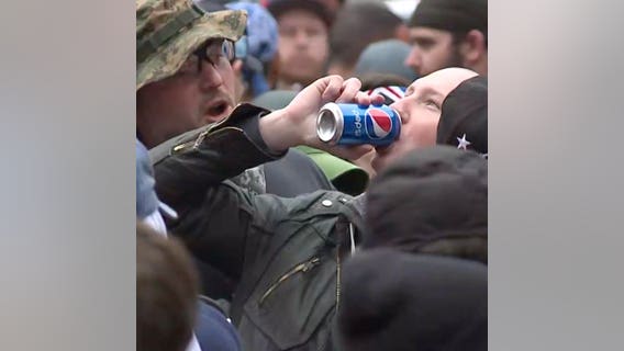 Trump and anti-Trump supporters share 'peace joint,' Pepsi at May Day protest (VIDEO)