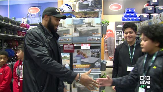 Seahawks players shop for Christmas with kids in Renton
