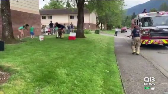Washington boy challenges firefighters to epic socially-distant water fight