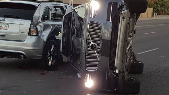 Uber suspends self-driving car program after Arizona crash