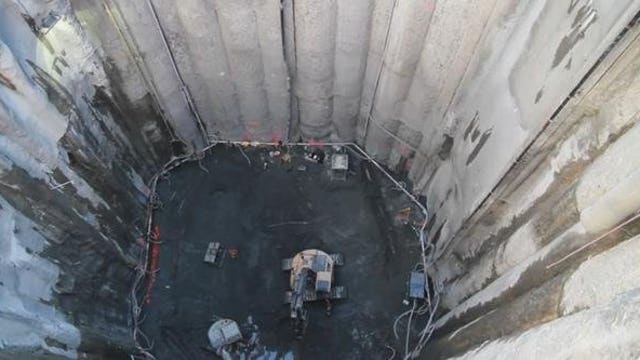 Tunnel contractor completes excavation of 120-foot-deep pit to access damaged Bertha machine