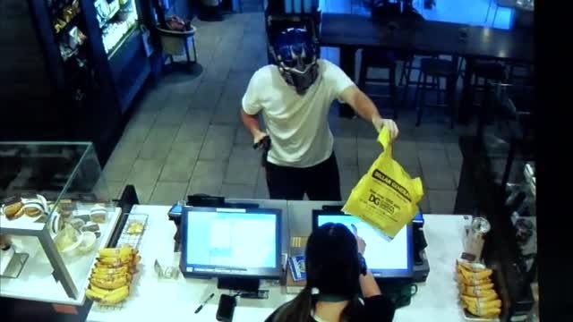 Dramatic video shows Starbucks customer fighting off armed robber