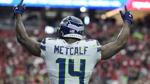 D.K. Metcalf runs the 100 meter race to increase speed for football season