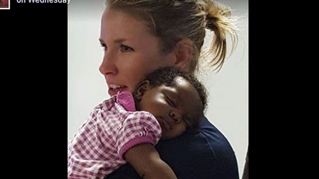 Police officer comforts 1-month-old baby girl after her parents overdose