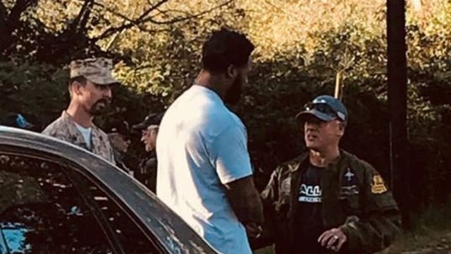 Michael Bennett greets veterans outside VMAC, and an actual dialogue ensues