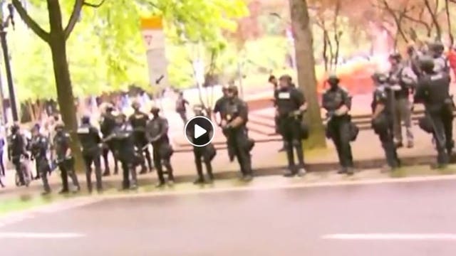 Portland police arrest 4 during protests that turned violent