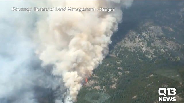 Officials predict another month of US wildfires