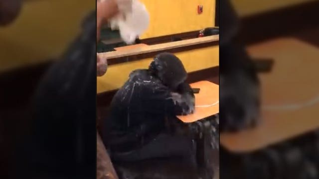 Video shows Dunkin’ Donuts employee dumping water on sleeping homeless man