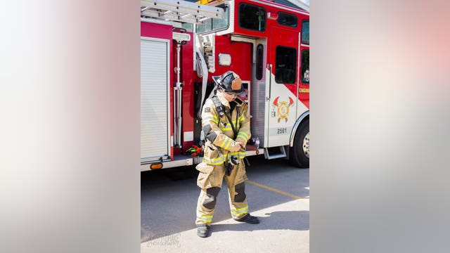 Firefighter stands for 1 minute for every firefighter who died on 9/11