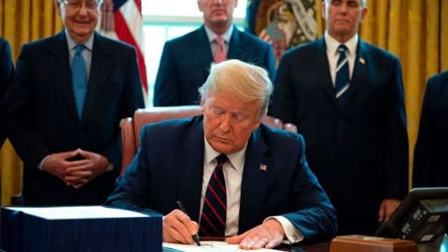 Trump signs $484 billion measure to aid employers, hospitals