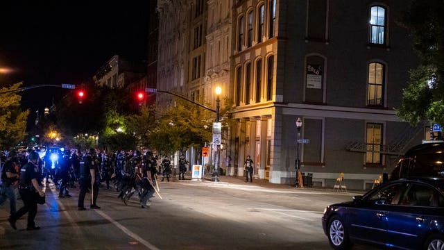 Louisville police and soldiers return fire, killing man