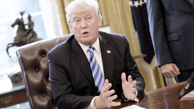 Blaming conservatives, Trump signals new openness to Dems