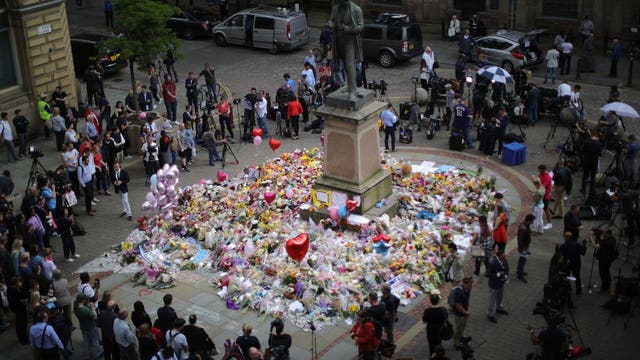 UK lowers terror threat level to 'severe' as more arrested