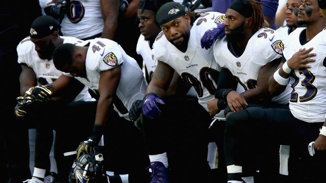 At least 100 NFL players kneel during national anthem