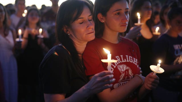 In aftermath of shooting, a community mourns and wonders why