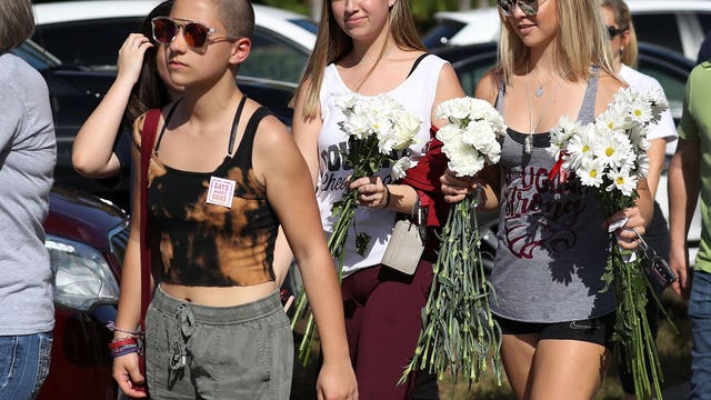 Florida students unite as they re-enter school shooting site