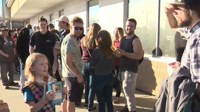 Canadian girl sells out of cookies in minutes to crowd outside marijuana store