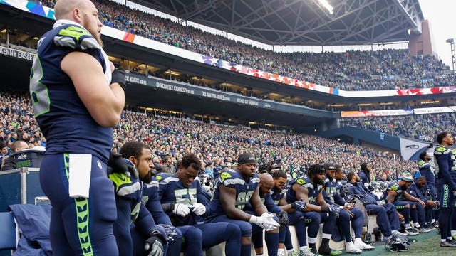 About 18 NFL players protest during national anthem