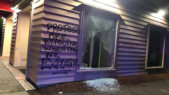 Portland, Oregon protesters set fire to police precinct, tear gas used