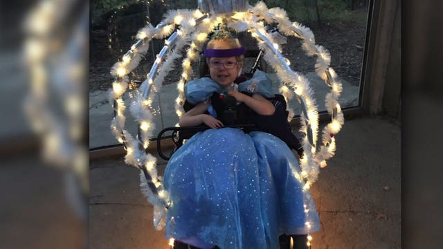 Three-year-old princess celebrates Halloween with a stylish set of wheels
