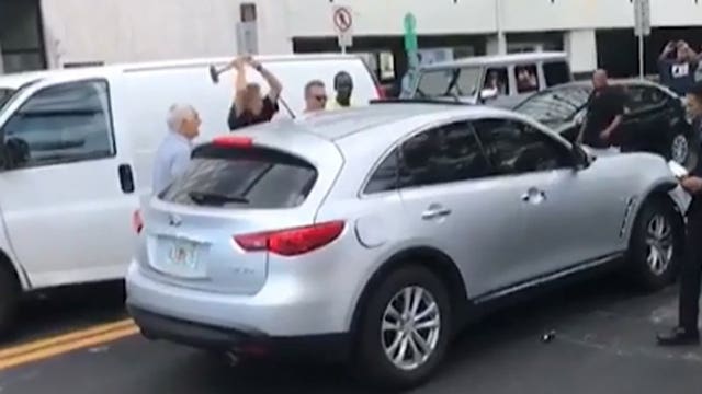 Man uses sledgehammer to try to stop alleged hit-and-run driver from leaving scene