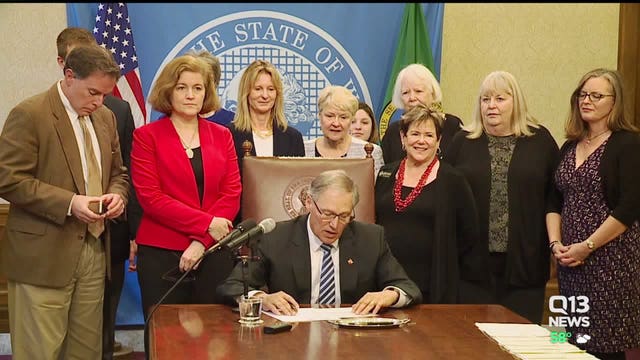 Dozens of bills signed into law, including on sexual harassment, equal pay and guns