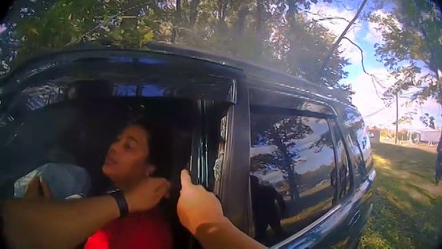 Video shows police officer, good Samaritan bend door of burning car to free women