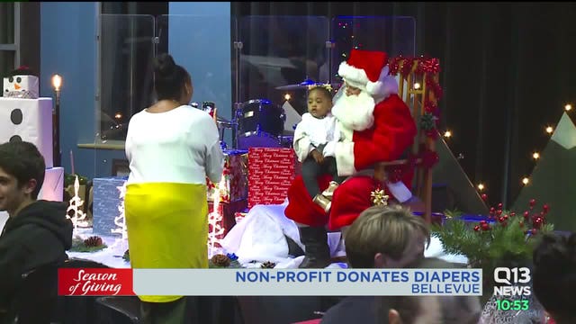 Families in Bellevue receive priceless gift of diapers during Christmas party