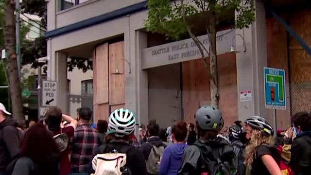 Protesters march to East Precinct after Seattle police reopen streets