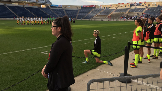 Seattle Reign FC star Megan Rapinoe kneels during national anthem