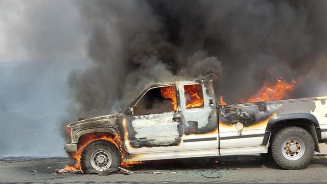 Car fire sparks wildfire off I-90 near Ryegrass