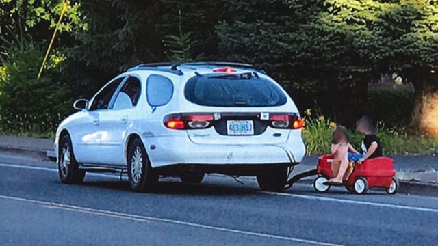 Oregon mother arrested after using car to tow kids in plastic wagon