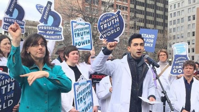 Scientists protest threats to science in Boston