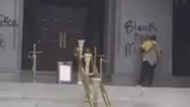 Donald Trump's new hotel tagged with 'Black Lives Matter' graffiti