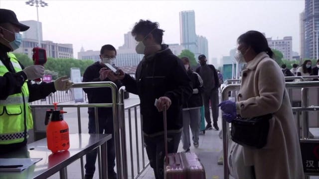 Masked crowds fill Wuhan's streets, trains as lockdown ends