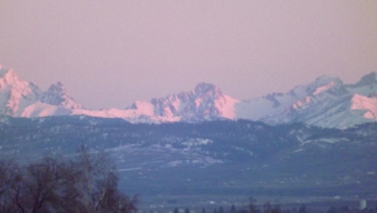 Sunrise over the Stuarts. From Karen in Ellensburg.