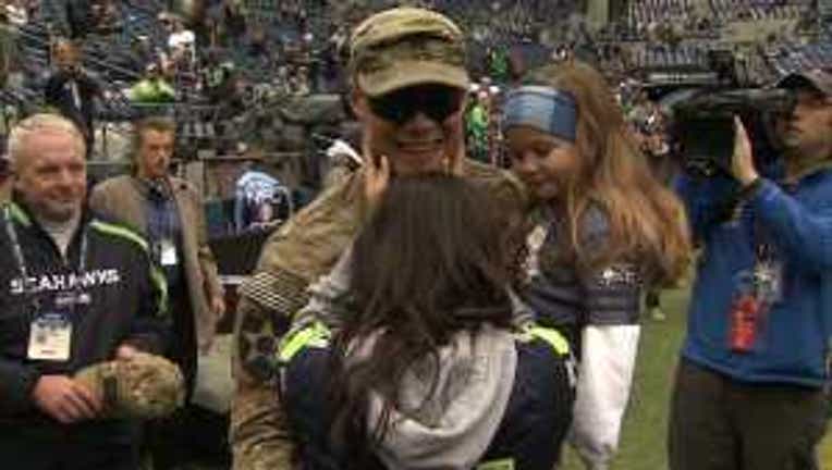 Dad returns from tour Seahawks game