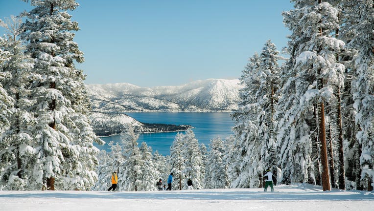 Mountain skiing with lake view