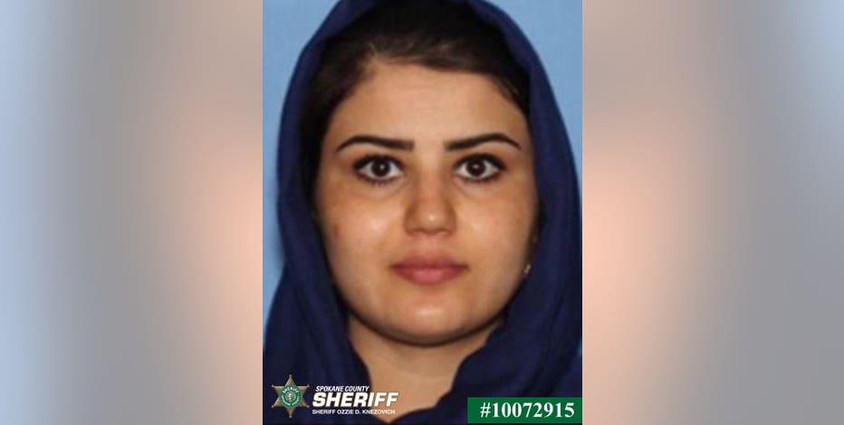 Woman's body found hidden under freezer; warrant issued for husband who left country