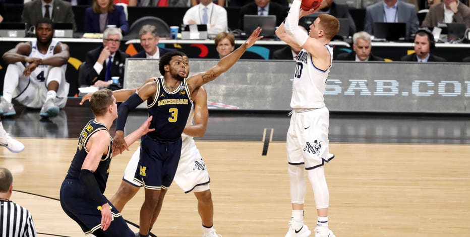 Villanova takes title, 79-62 over Michigan behind DiVincenzo