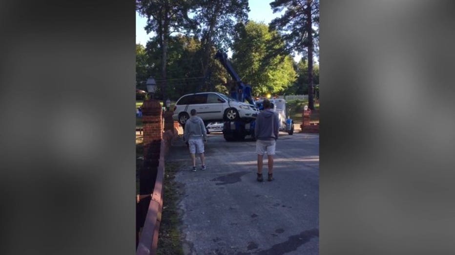 The minivan was pulled from the creek bed Friday morning.