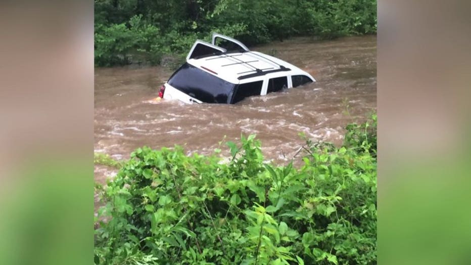 Man, dog rescued from SUV in King William County.