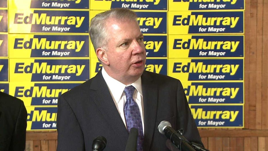 ed murray speaks at a podium 