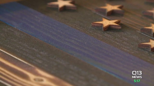 'Thin blue line' stickers snatched from Tacoma police cars after public criticism