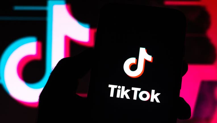 17eb004c-In this photo illustration a TikTok logo seen displayed on a