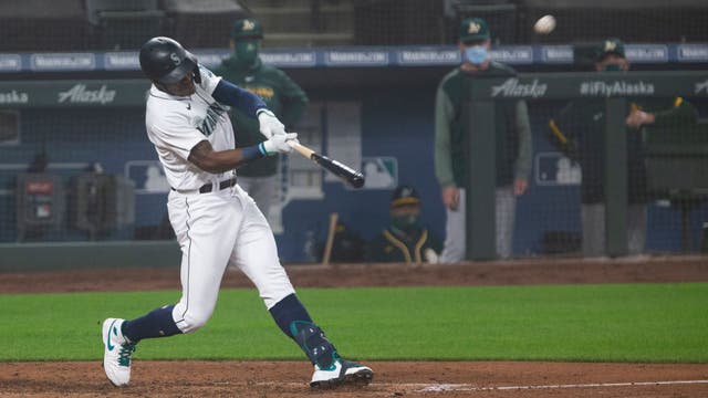 Mariners rally to topple Athletics 6-5 in first game of doubleheader